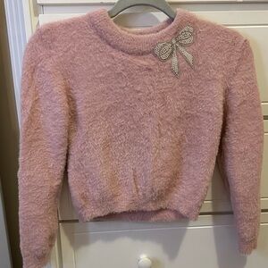 Elegant Pink Fuzzy Sweater with Bow Accent